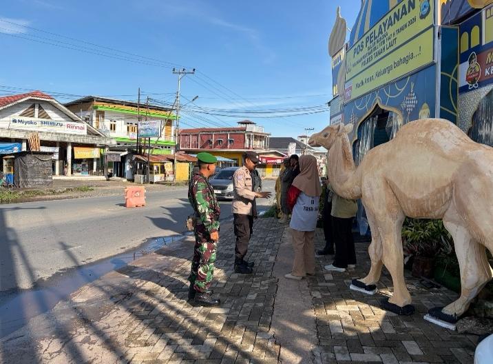 Bersinergi Dengan Polres Tala Personel Kodim 1009/Tla Siaga Di Pos Pelayanan Desa Bentok